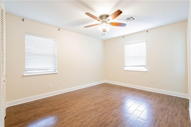 2924 Elizabeth St, Metairie, LA 70003 - spare room featuring a ceiling fan, wood finished floors, baseboards, and a textured ceiling