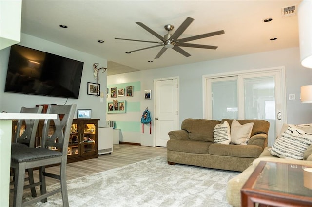 5121 Pike Dr, Metairie, LA 70003 - living area featuring a ceiling fan, wood finished floors, and recessed lighting