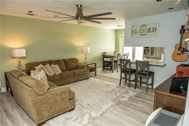 5121 Pike Dr, Metairie, LA 70003 - living area with ceiling fan and wood finished floors