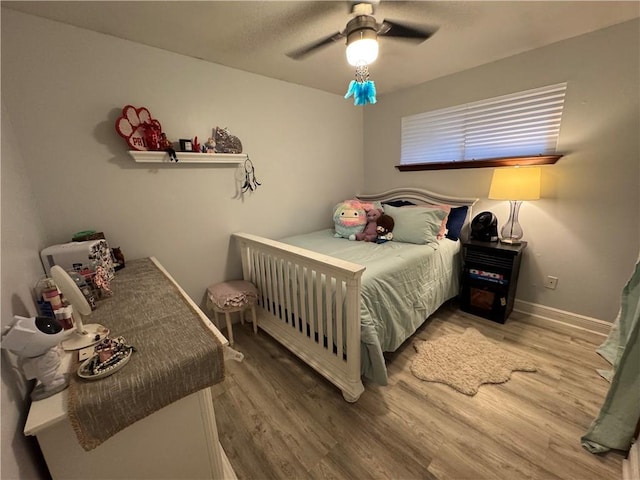 5121 Pike Dr, Metairie, LA 70003 - bedroom with light wood-type flooring and a ceiling fan