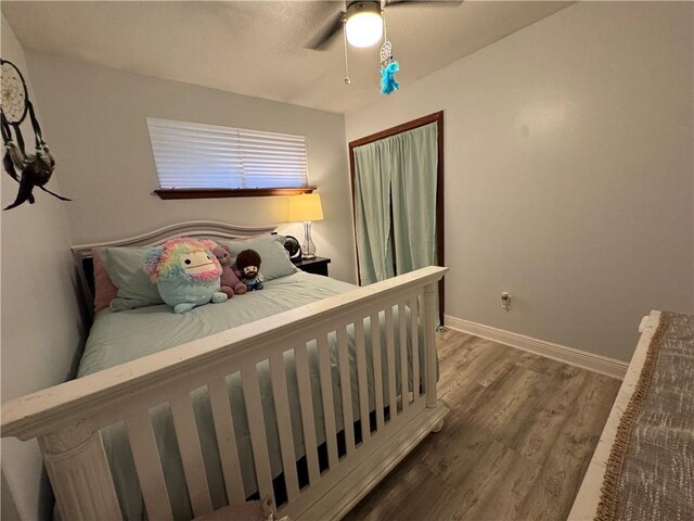 5121 Pike Dr, Metairie, LA 70003 - bedroom with wood finished floors and ceiling fan