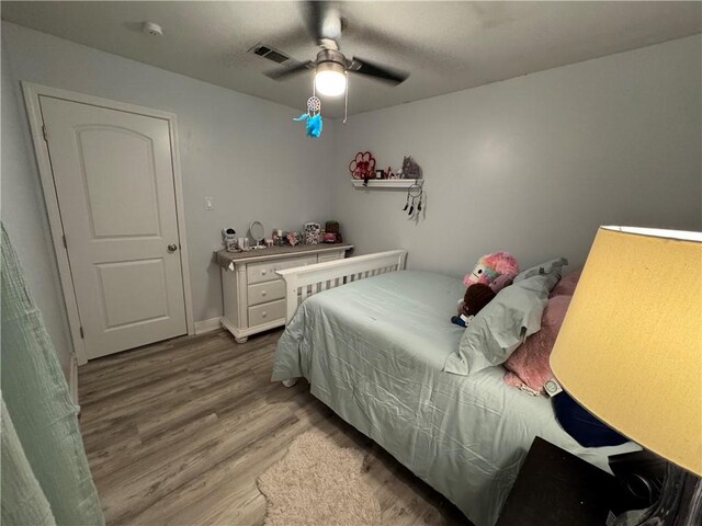 5121 Pike Dr, Metairie, LA 70003 - bedroom with wood finished floors and ceiling fan