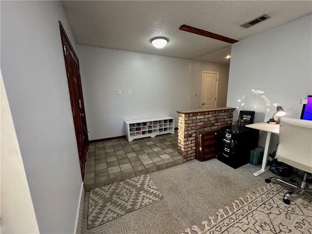 5121 Pike Dr, Metairie, LA 70003 - carpeted office featuring a textured ceiling and baseboards