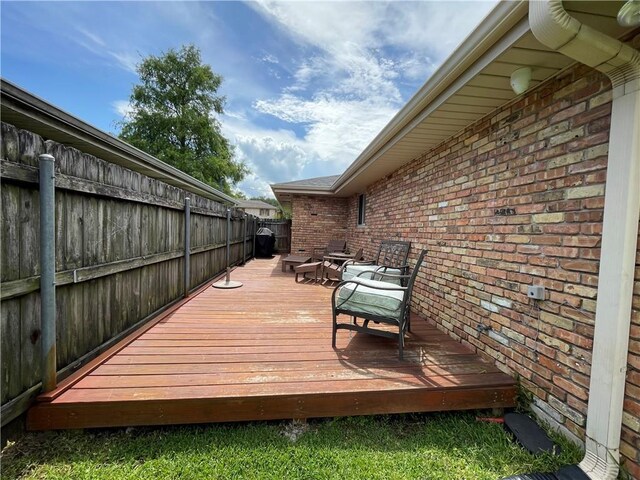 5121 Pike Dr, Metairie, LA 70003 - wooden deck featuring a fenced backyard