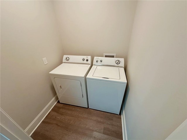 206 E Pecan St, Ponchatoula, LA 70454 - laundry room featuring washer and dryer, wood finished floors, and baseboards