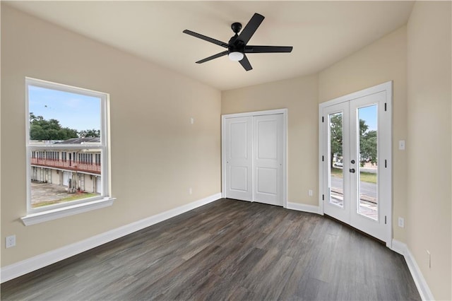 233234 S Liberty St, New Orleans, LA 70113 - unfurnished bedroom with access to outside, dark wood finished floors, french doors, baseboards, and a ceiling fan