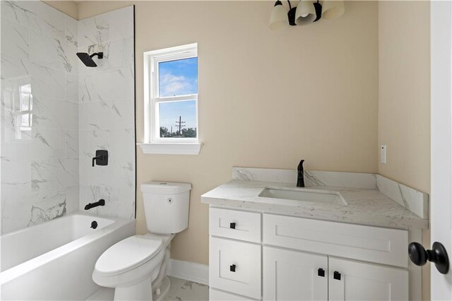 233234 S Liberty St, New Orleans, LA 70113 - bathroom with toilet, vanity, marble look tile flooring, shower / bath combination, and baseboards
