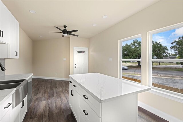 233234 S Liberty St, New Orleans, LA 70113 - kitchen featuring dark wood-style floors, recessed lighting, white cabinets, ceiling fan, and baseboards