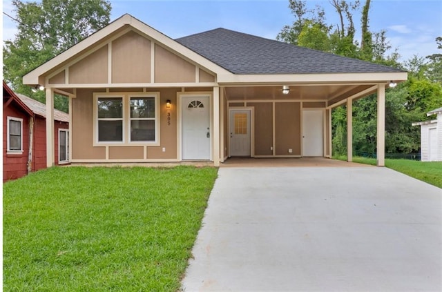 305 S Walnut St, Hammond, LA 70403 - view of front of property with concrete driveway, a shingled roof, a front lawn, and a carport