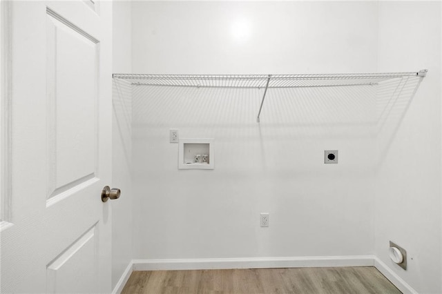 305 S Walnut St, Hammond, LA 70403 - washroom with electric dryer hookup, hookup for a washing machine, light wood-type flooring, and baseboards