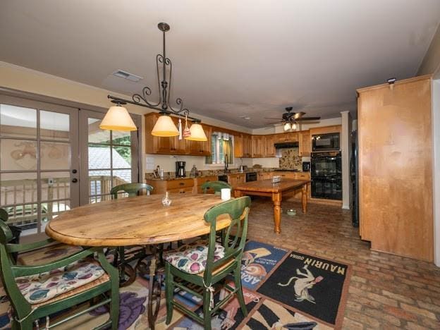 109 Kendrick Dr, Slidell, LA 70461 - dining area featuring brick flooring and ceiling fan