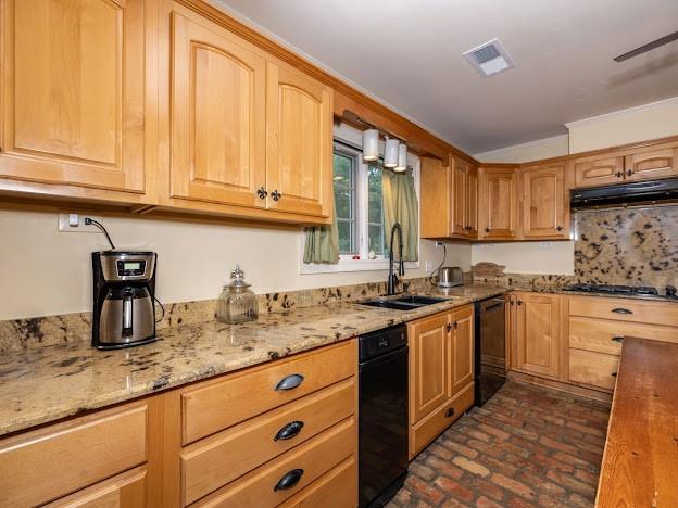 109 Kendrick Dr, Slidell, LA 70461 - kitchen with stainless steel gas cooktop, brick flooring, a sink, under cabinet range hood, and light stone counters
