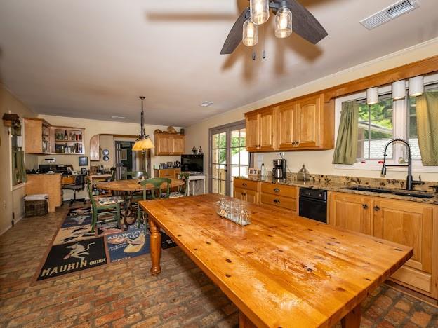 109 Kendrick Dr, Slidell, LA 70461 - dining area featuring brick flooring, arched walkways, and ceiling fan