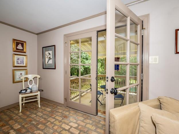 109 Kendrick Dr, Slidell, LA 70461 - doorway featuring french doors, ornamental molding, and baseboards