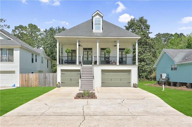18123 Cusachs Dr, Covington, LA 70433 - coastal inspired home featuring ceiling fan, concrete driveway, an attached garage, stairs, and a shingled roof