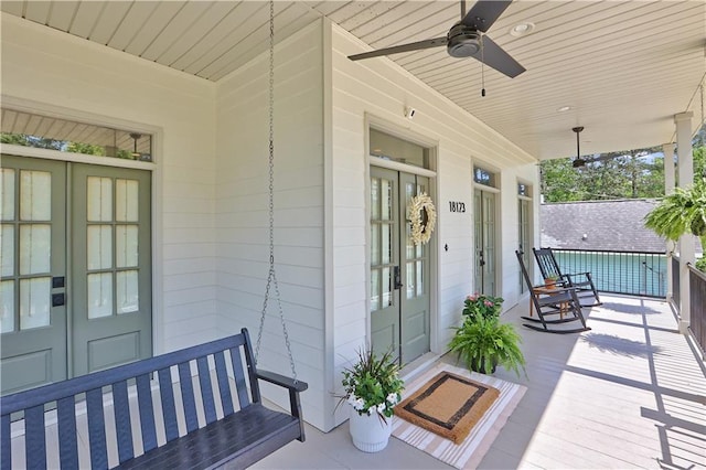 18123 Cusachs Dr, Covington, LA 70433 - wooden porch featuring french doors and ceiling fan