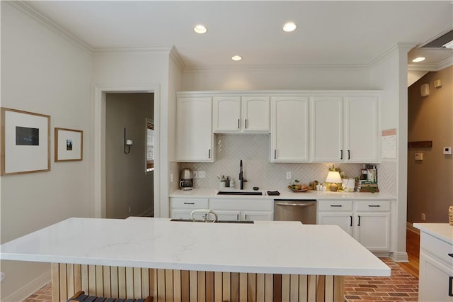18123 Cusachs Dr, Covington, LA 70433 - kitchen featuring a sink, stainless steel dishwasher, brick floors, crown molding, and white cabinets