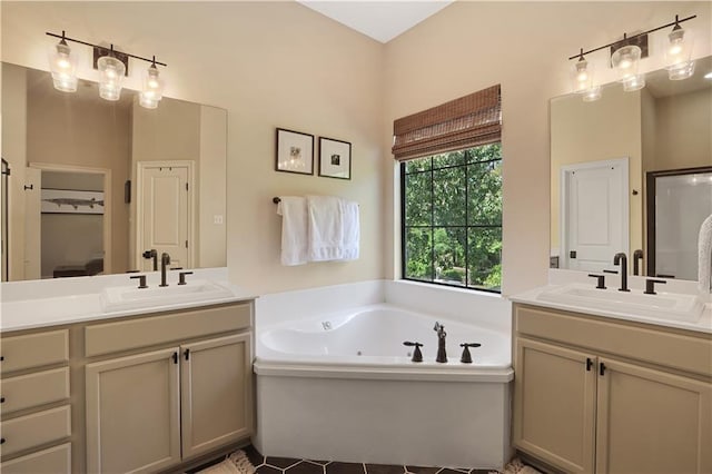 18123 Cusachs Dr, Covington, LA 70433 - bathroom with two vanities, a garden tub, tile patterned flooring, and a closet