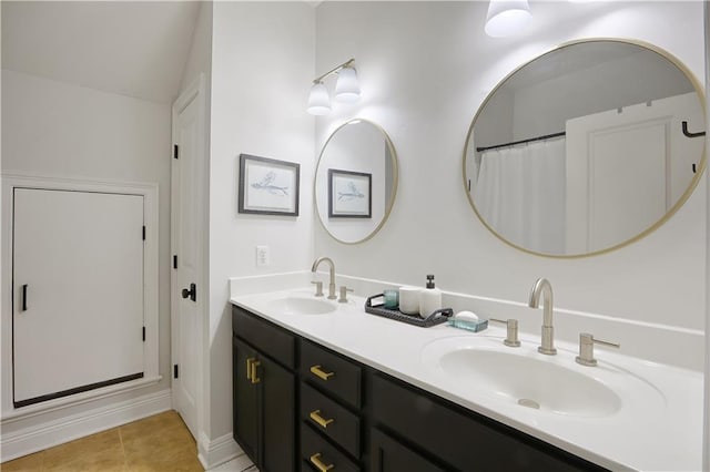 18123 Cusachs Dr, Covington, LA 70433 - bathroom with double vanity, tile patterned flooring, and baseboards