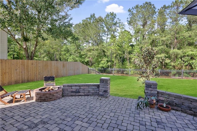 18123 Cusachs Dr, Covington, LA 70433 - view of patio with an outdoor fire pit