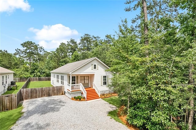 502 W 7th Ave, Covington, LA 70433 - view of front facade featuring a porch and gravel driveway