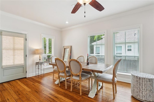 502 W 7th Ave, Covington, LA 70433 - dining area featuring crown molding, wood-type flooring, a ceiling fan, and baseboards