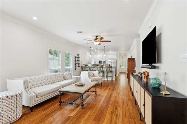 502 W 7th Ave, Covington, LA 70433 - living area featuring ornamental molding, ceiling fan, light wood-type flooring, and recessed lighting