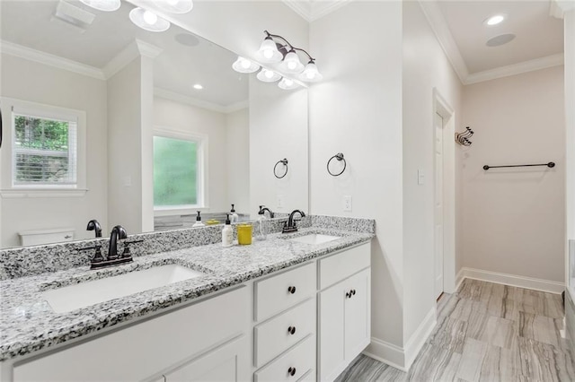 502 W 7th Ave, Covington, LA 70433 - bathroom featuring double vanity, baseboards, ornamental molding, and toilet