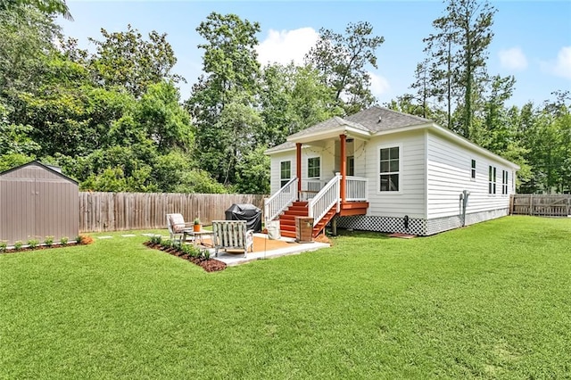 502 W 7th Ave, Covington, LA 70433 - back of house featuring a patio and view of wooded area