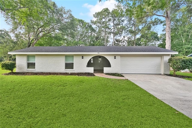 351 Huntington Dr, Slidell, LA 70458 - view of front of property featuring an attached garage, brick siding, a front yard, and concrete driveway