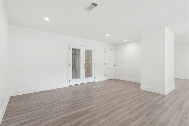 351 Huntington Dr, Slidell, LA 70458 - empty room with french doors, light wood-type flooring, baseboards, and recessed lighting