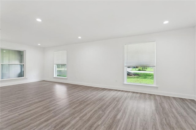 351 Huntington Dr, Slidell, LA 70458 - unfurnished room with healthy amount of natural light, wood finished floors, recessed lighting, and baseboards