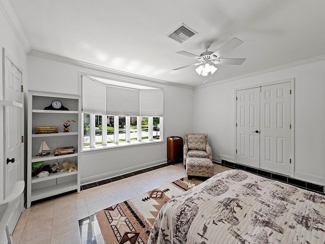 1104 Sena Dr, Metairie, LA 70005 - bedroom featuring ornamental molding, light tile patterned flooring, baseboards, a ceiling fan, and a closet