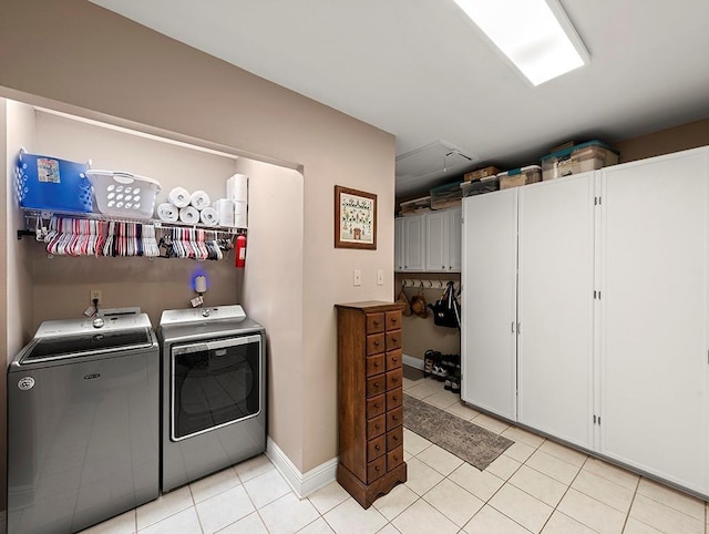 1104 Sena Dr, Metairie, LA 70005 - laundry room with washer and dryer, light tile patterned flooring, and baseboards