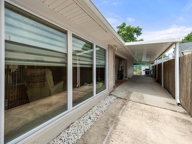 1104 Sena Dr, Metairie, LA 70005 - view of patio with a carport and concrete driveway