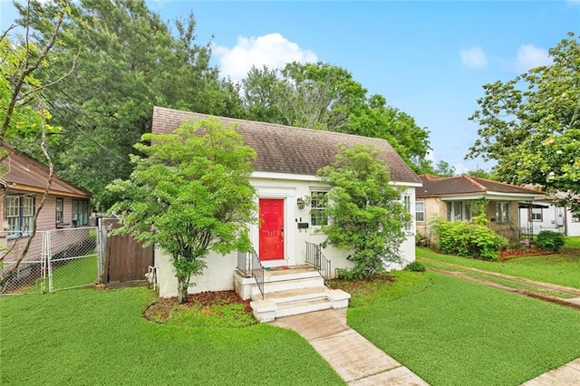 727 Bonnabel Blvd, Metairie, LA 70005 - view of front facade featuring stucco siding and a shingled roof