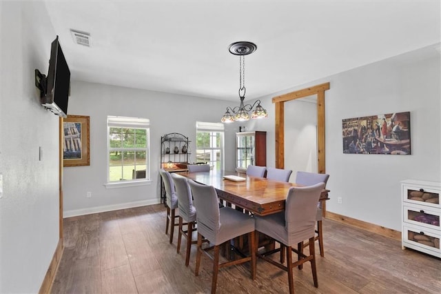 23375 Lowe Davis Rd, Covington, LA 70435 - dining space with dark wood-style flooring and baseboards