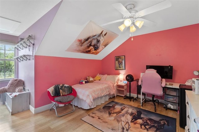 23375 Lowe Davis Rd, Covington, LA 70435 - bedroom with wood finished floors, vaulted ceiling, baseboards, and a ceiling fan