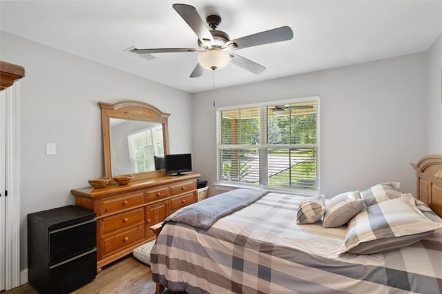 23375 Lowe Davis Rd, Covington, LA 70435 - bedroom with light wood-type flooring and a ceiling fan