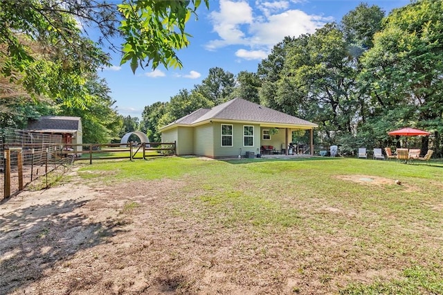 23375 Lowe Davis Rd, Covington, LA 70435 - back of property with a patio and an outbuilding