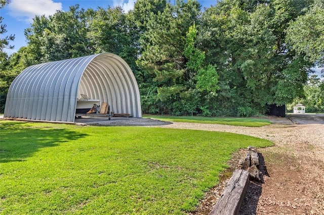 23375 Lowe Davis Rd, Covington, LA 70435 - view of green lawn with an outbuilding and view of scattered trees