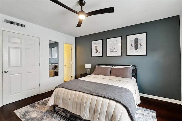 1422 Dauphine St Unit 8, New Orleans, LA 70116 - bedroom with wood finished floors, baseboards, and a ceiling fan