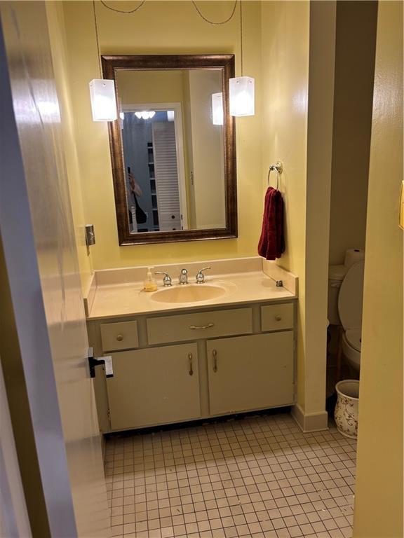 2836 Steamship Cir Unit A, River Ridge, LA 70123 - half bath featuring vanity, tile patterned flooring, and toilet