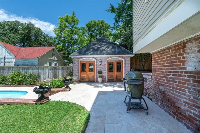 212 Linton Ave, Natchez-Ms, MS 39120 - view of patio / terrace with an outdoor structure and a storage structure