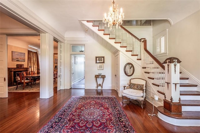212 Linton Ave, Natchez-Ms, MS 39120 - foyer entrance featuring stairs, a chandelier, hardwood / wood-style floors, and baseboards