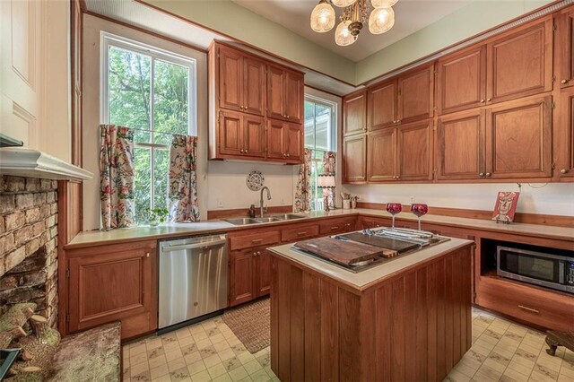 212 Linton Ave, Natchez-Ms, MS 39120 - kitchen featuring appliances with stainless steel finishes, a sink, light floors, and plenty of natural light