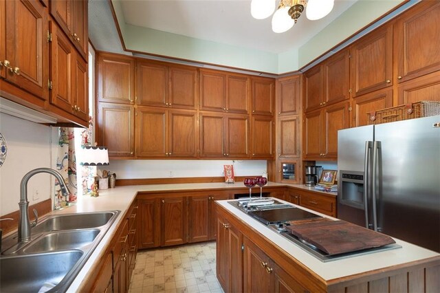 212 Linton Ave, Natchez-Ms, MS 39120 - kitchen featuring a sink, stainless steel refrigerator with ice dispenser, brown cabinets, light flooring, and light countertops