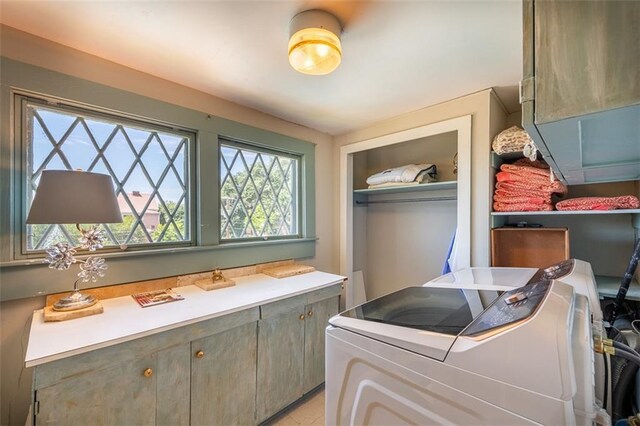 212 Linton Ave, Natchez-Ms, MS 39120 - laundry area featuring cabinet space, plenty of natural light, and washing machine and clothes dryer