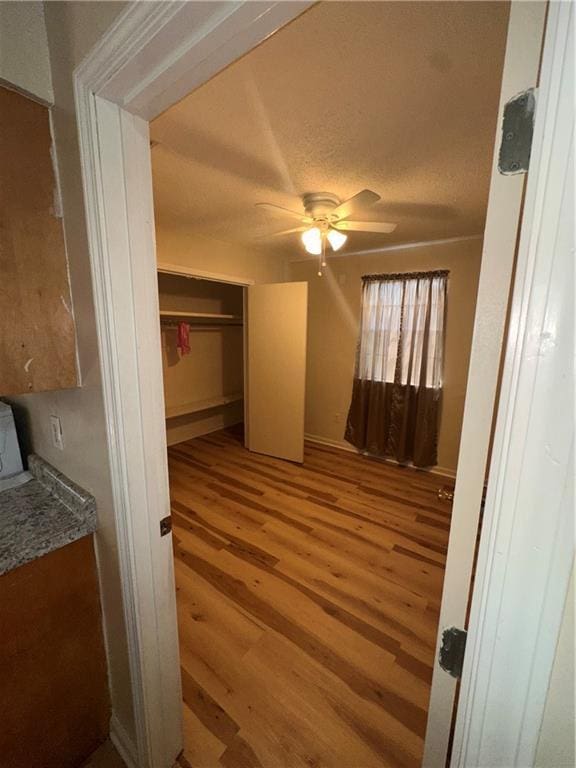 70915 S Gayoso St, New Orleans, LA 70119 - unfurnished bedroom featuring wood finished floors, a closet, and a ceiling fan