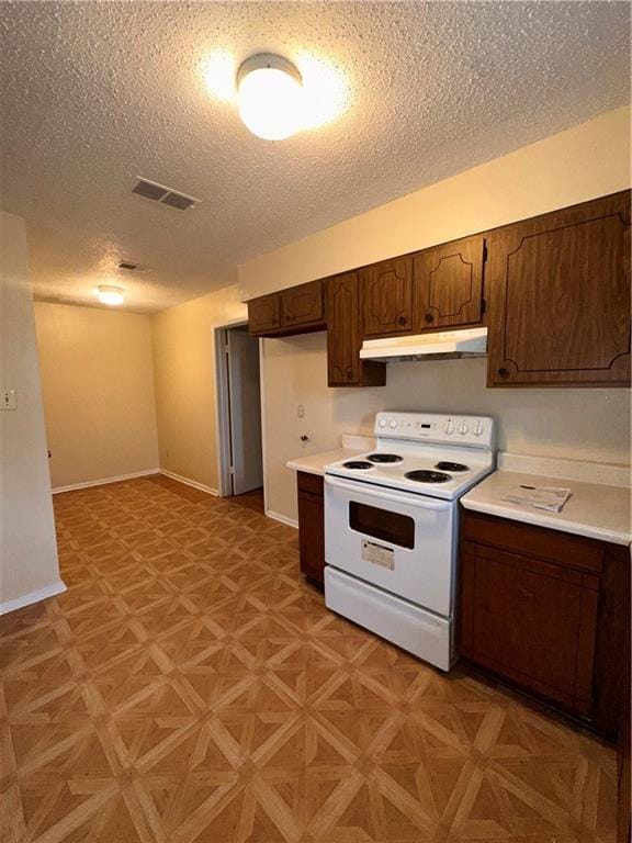 70915 S Gayoso St, New Orleans, LA 70119 - kitchen featuring white electric stove, under cabinet range hood, light countertops, a textured ceiling, and dark brown cabinetry
